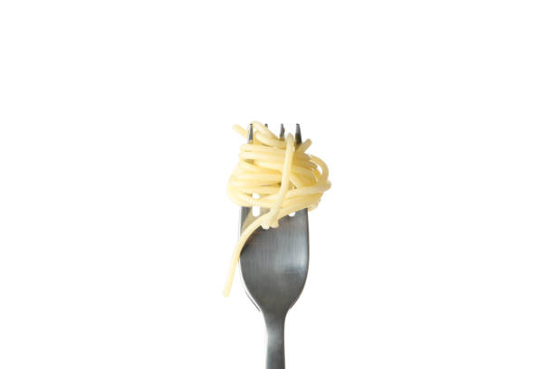 istock Fork with tasty pasta isolated on white background 1223135324