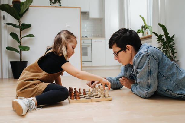 istock Dad and dau learning chess on a kitchen floor at home 1223137211