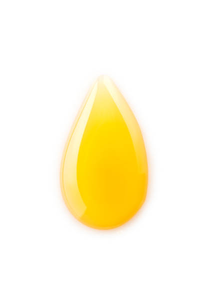 istock Macro honey drops isolated on white background 1223137966