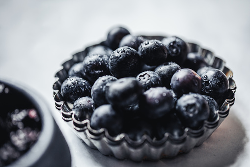 Close up photograph of blueberries used for a lattice pie