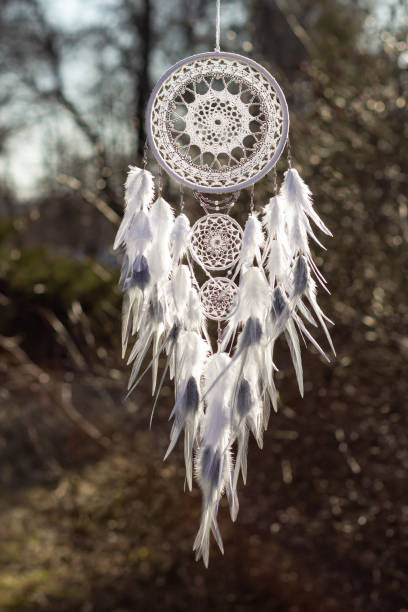 istock Handmade dream catcher with feathers threads and beads rope hanging 1223140967