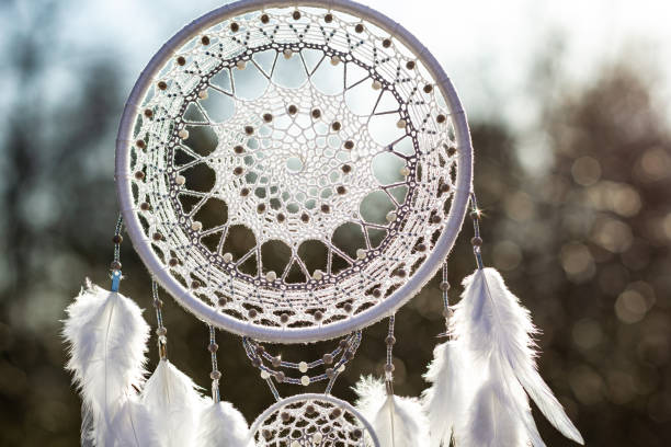 istock Handmade dream catcher with feathers threads and beads rope hanging 1223140981