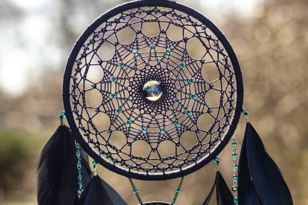 istock Handmade dream catcher with feathers threads and beads rope hanging 1223140993