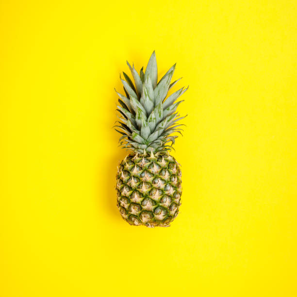 istock Pineapple on yellow background. Summer concept. Flat lay 1223142247