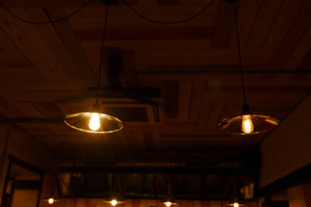 istock Stylish lighting lamps over a bar counter in a loft hookah bar 1223143670