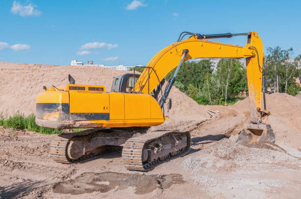 istock Excavator digs a hole on the construction site. 1223144042