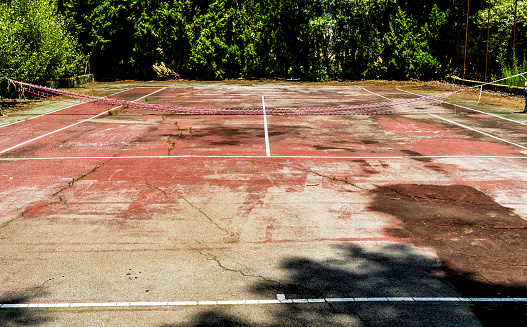 Grunge abandoned tennis court