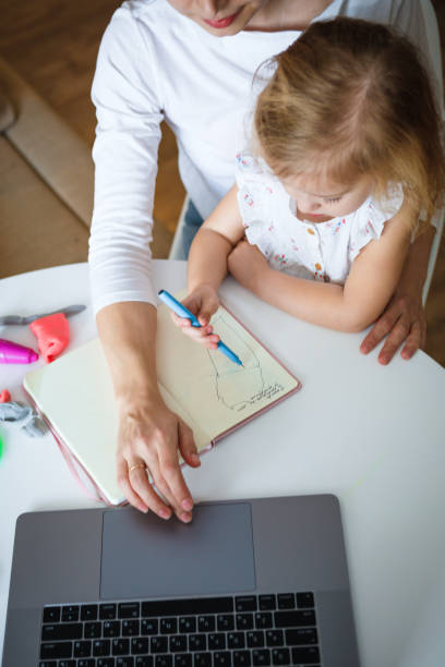 istock Work at home during quarantine. Mom with a child. 1223146591
