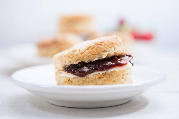 istock British scones with butter and strawberry jam on white wooden table. 1223148469