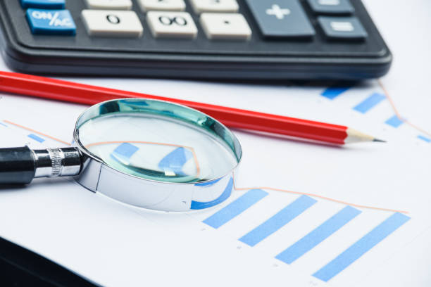 istock Business financial documents, office calculator and pen on the table. Numbers and graphs. 1223148541