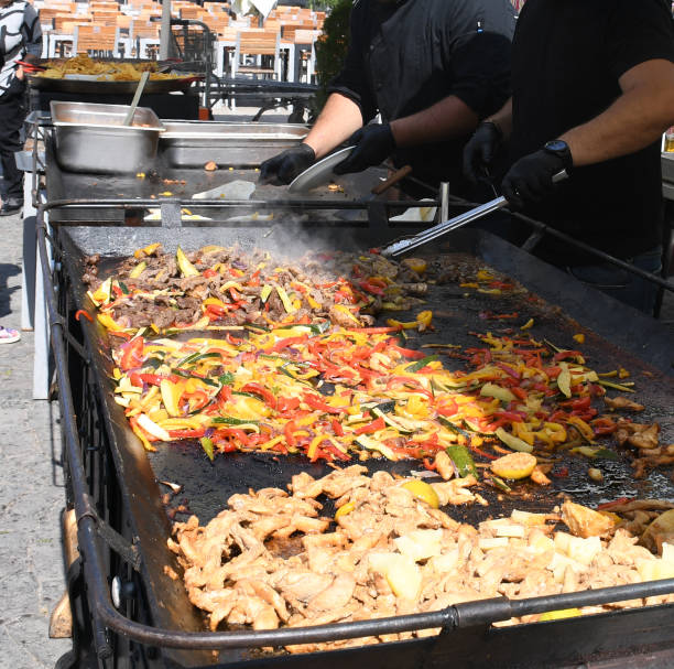 The process of preparing a quesadilla, traditional Mexican dish. Outdoor outside setting