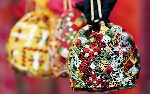 Indian woman purse retail display in a market