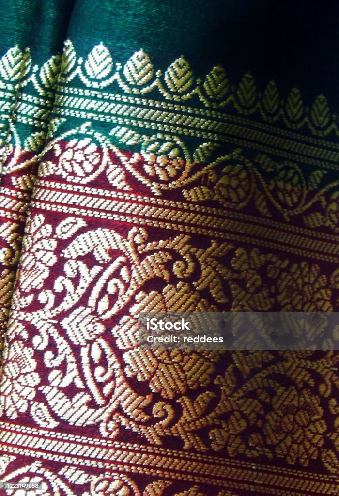 Close-up view of Indian woman clothes saree or sari texture view of Indian woman clothes saree or sari texture Zari - Textile Stock Photo