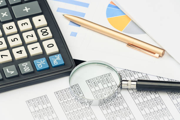 istock Business financial documents, office calculator and pen on the table. Numbers and graphs. 1223151682