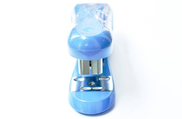 big blue stapler for pushing paper on white background - table toughness steel pattern imagens e fotografias de stock