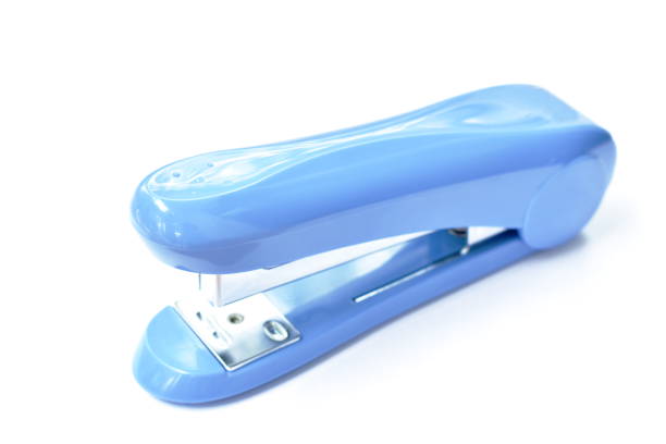 big blue stapler for pushing paper on white background - table toughness steel pattern imagens e fotografias de stock
