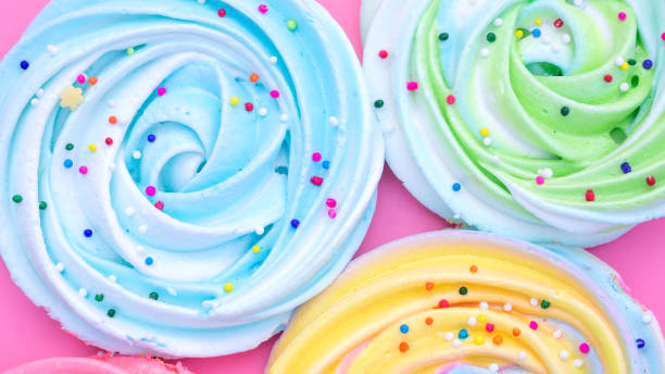 istock Colorful meringue lollipop on a pink background. 1223156484
