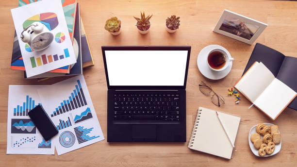istock working from home. laptop computer with blank white screen for copy space, work at home during self isolation to avoid spreading illness transmission of COVID-19 Coronavirus outbreak. 1223157820