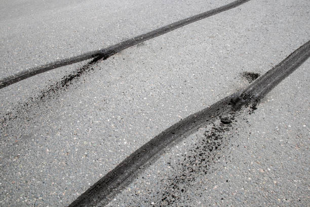 istock car tyre skid marks on road 1223158581