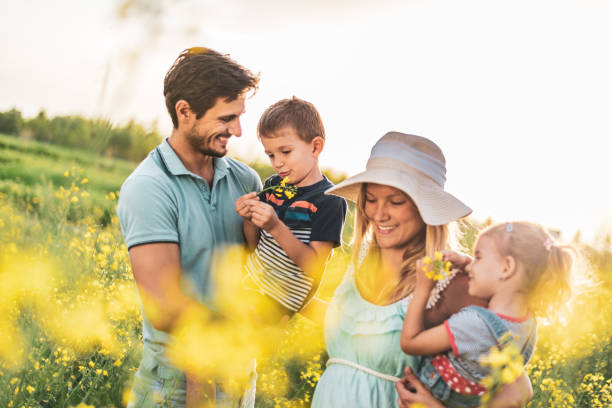istock Young happy family enjoying nature 1223159687
