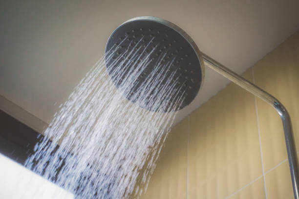 istock Shower Head Spraying Water In Bathroom 1223159898