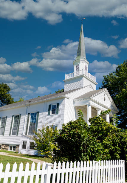 istock White Church Past Picket Fence 1223160104