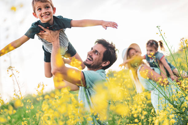 istock Young happy family enjoying nature 1223160112