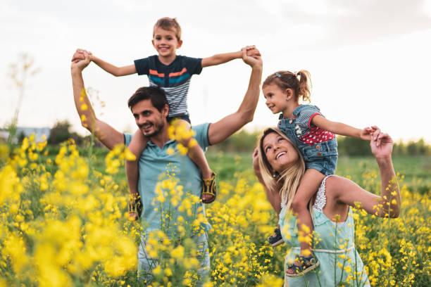 istock Young happy family enjoying nature 1223160909