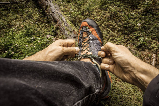 istock fastening your mountain shoes inside a forest 1223161103
