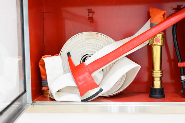 Rescue firefighter equipment, ax and fire line in red box.Fire fighting and safety concept. stock photo