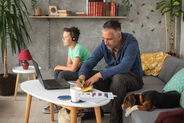 istock Man working from home during during COVID-19 pandemic 1223164130