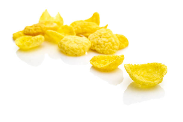 istock Healthy grains Cornflakes milk breakfast. Snack Cereal corn flakes isolated on white background. Clean-eating food with antioxidant, omega-3, protein and copy space. 1223164226
