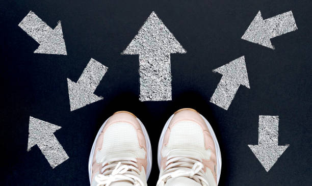 istock Taking decisions for the future man standing with many direction arrow choices, left, right or move forward 1223164379