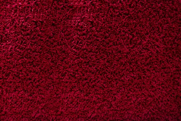 Photo of Red carpet textures with short hairs fiber for background, natural textile