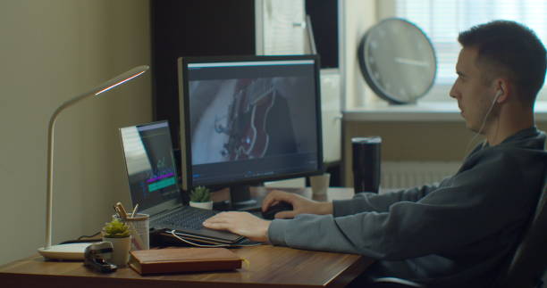 istock Video editing on a computer with Two Monitors. Monitor the computer and capture the work of the program for video editing. 1223166100