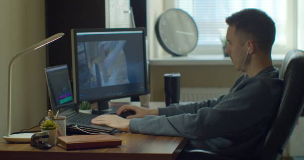 istock Video editing on a computer with Two Monitors. Monitor the computer and capture the work of the program for video editing. 1223166105