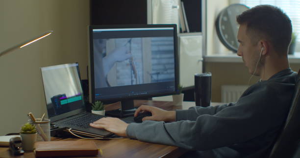 istock Video editing on a computer with Two Monitors. Monitor the computer and capture the work of the program for video editing. 1223166127