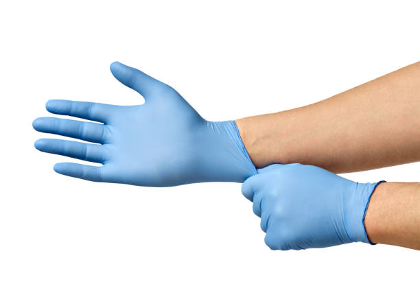 latex glove protective protection virus medical health hygiene hand close up of a hand with blue latex protective gloves on white background surgical glove stock pictures, royalty-free photos & images