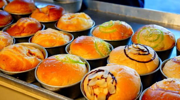 Close-up macro of muffins on bakery tray buffet for morning breakfast