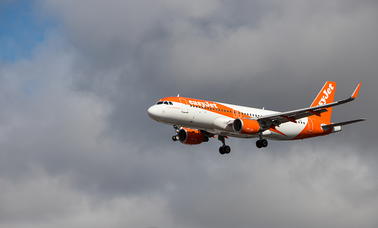 Oporto, Portugal - July 27, 2019: OE-IJA EasyJet Europe Airbus A320-214 in the air over Oporto airport