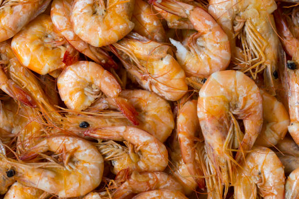 istock Cooking tiger prawns in a pan shot 1223168230