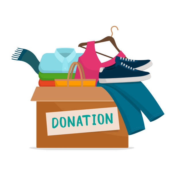 Clothing donation box Donation box with assorted clothing and shoes on white background, solidarity and charity concept donation box stock illustrations