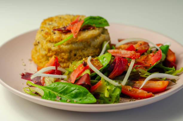 istock Smoked haddock fishcake with melting cheddar sauce and mixed salad 1223169068