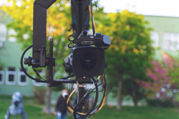 istock broadcast camera on the crane tripod for easy to shooting or recording and broadcasting content in outdoors studio 1223170896