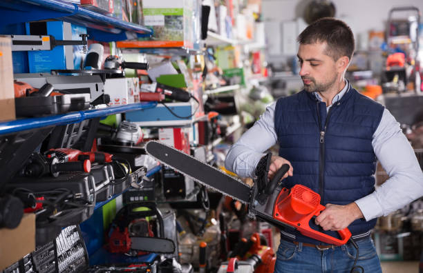 istock male is choosing electric saw 1223170918