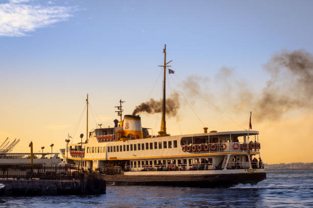 Big traditional Istanbul passenger ferryboat approaching to Kadikoy pier stock photo