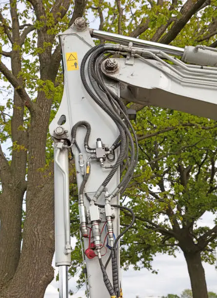 Photo of Hydrolic system of a small crane, selective focus