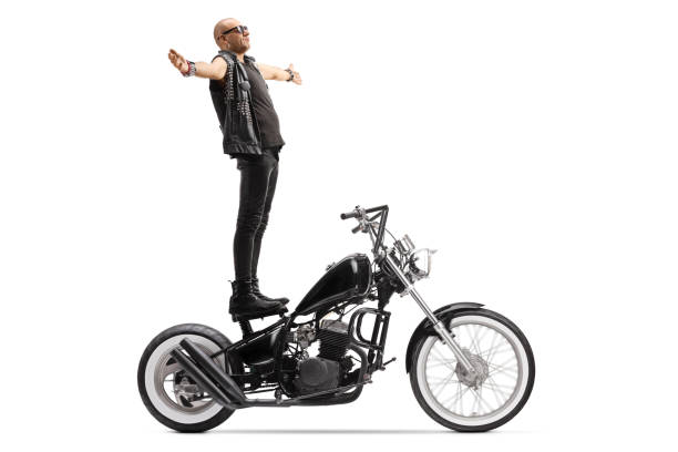 istock Bald punk daredevil man standing on a chopper motorbike 1223174066
