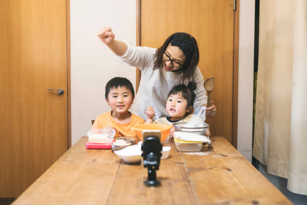 istock Family cooking for video streaming 1223174518