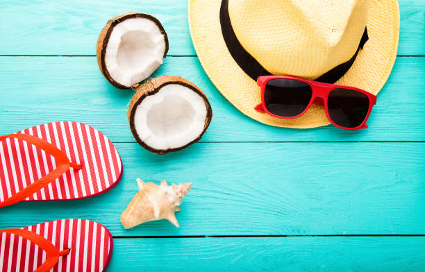 istock Summer plan and accessories, coconuts and pineapple on blue wooden background. Top view and copy space 1223174823